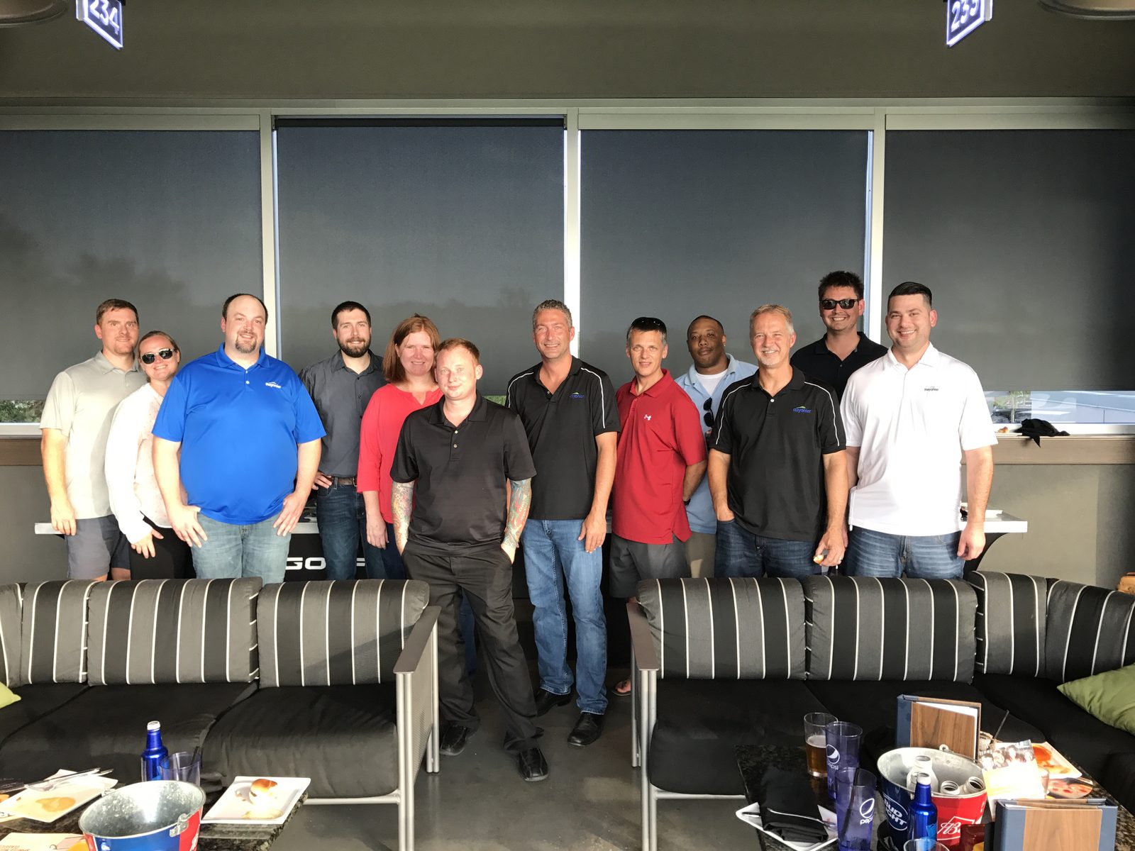 The team gathered for a group photo at a Topgolf offsite